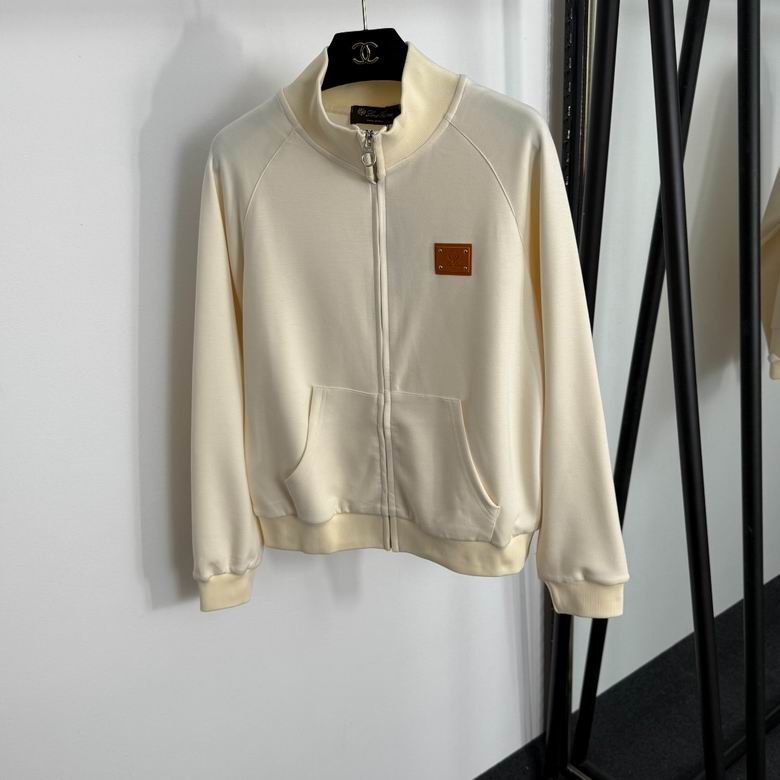 Conjunto de chaqueta y pantalón color beige con cremallera