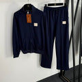 Conjunto de chaqueta y pantalón azul marino con cremallera