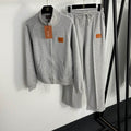Conjunto de chaqueta y pantalón con cremallera gris