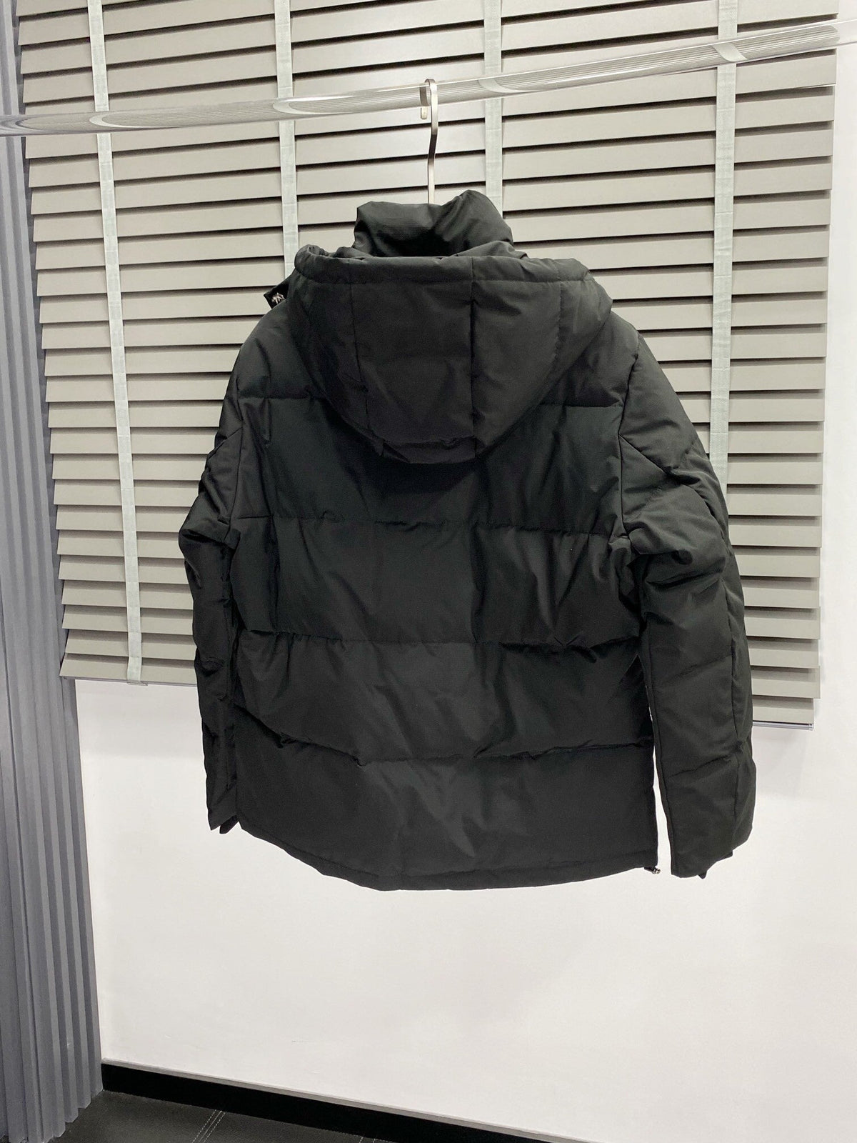Chaqueta acolchada con capucha de plumón