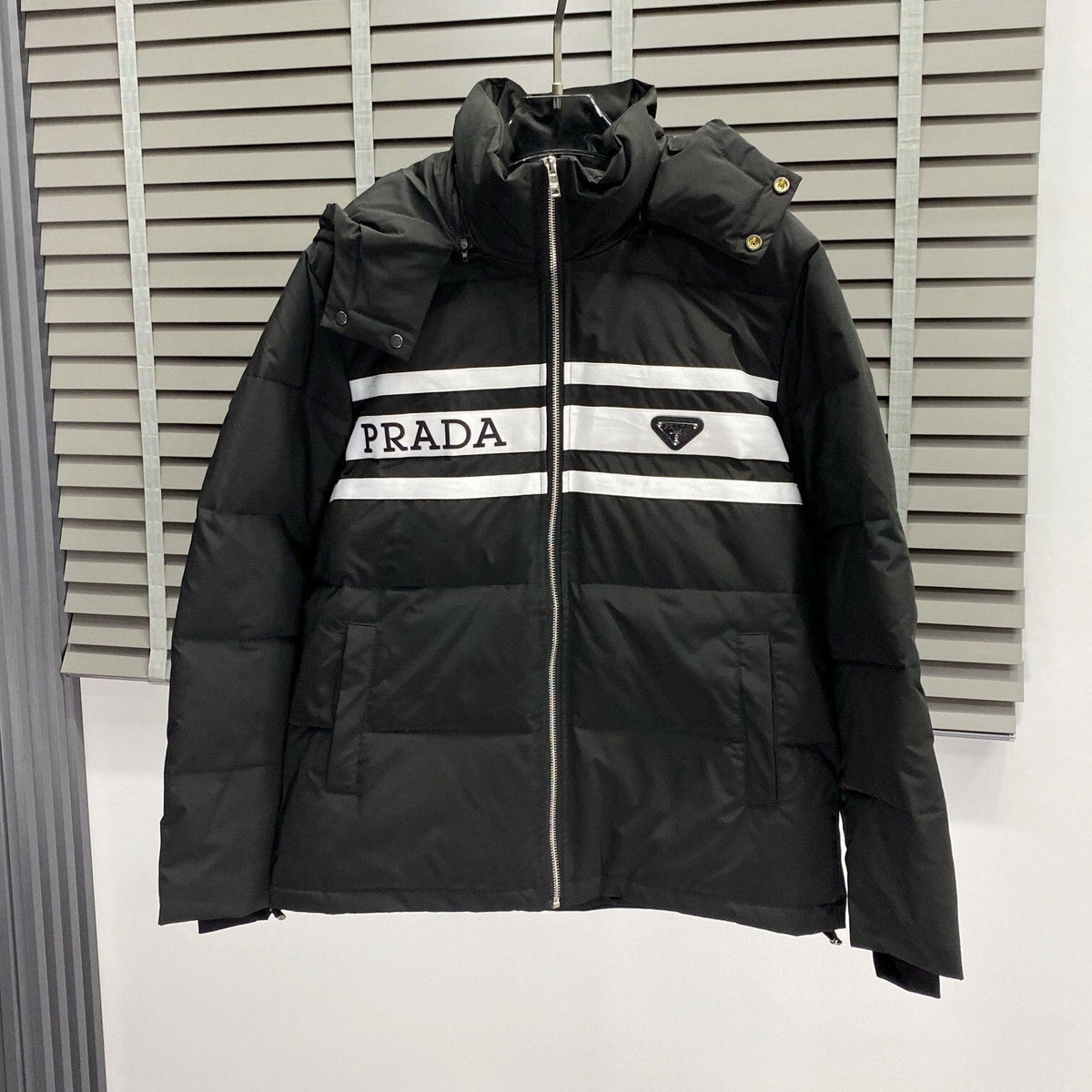 Chaqueta acolchada con capucha de plumón