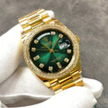 Reloj automático de 36 mm con esfera verde y dorada