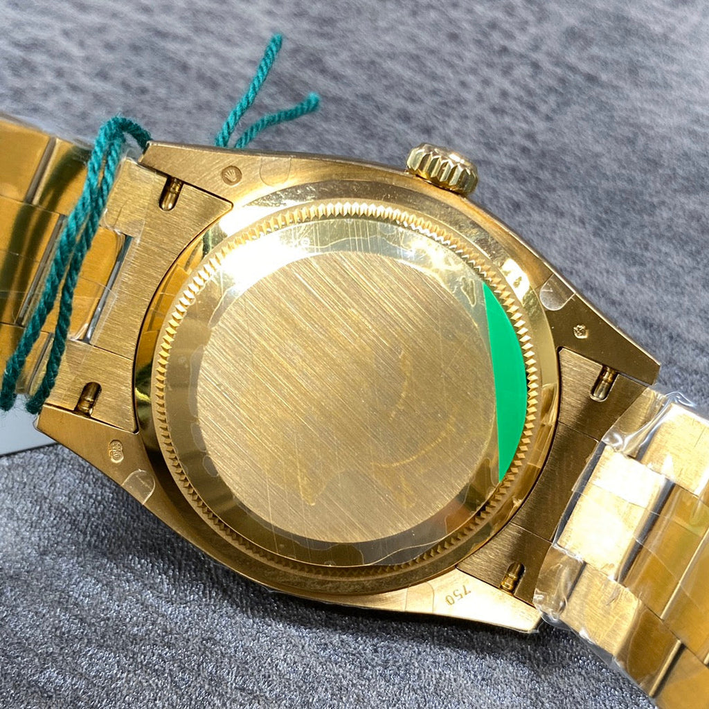 Reloj automático de 36 mm con esfera verde y dorada