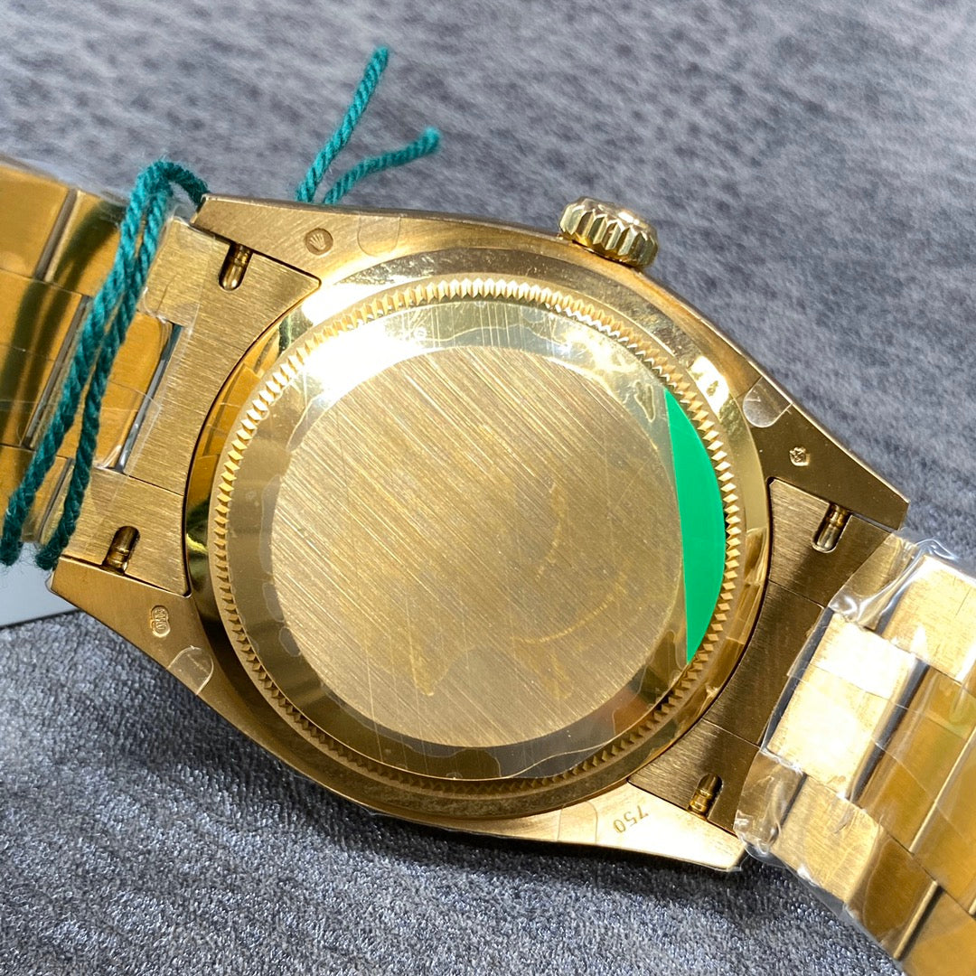 Reloj automático de 36 mm con esfera verde y dorada