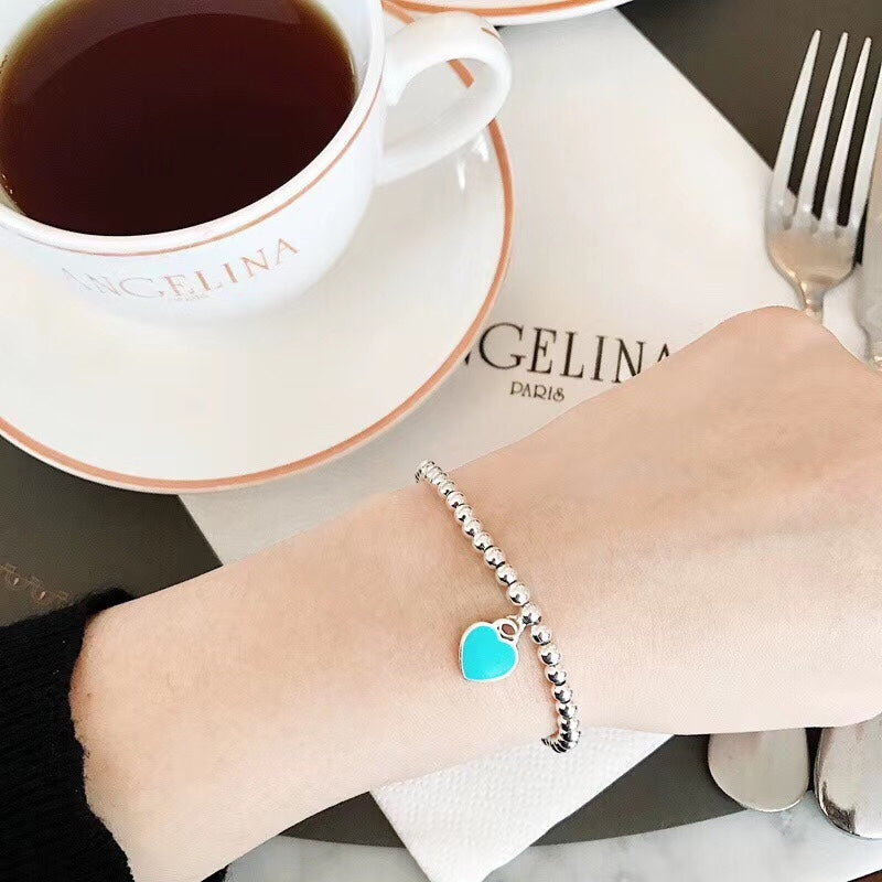 Pulsera de esmalte de doble corazón