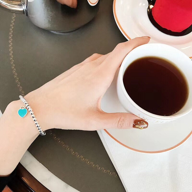 Pulsera de esmalte de doble corazón