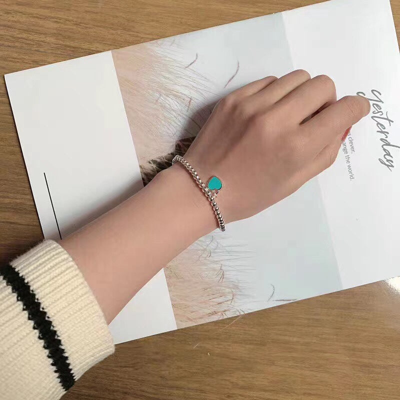 Pulsera de esmalte de doble corazón
