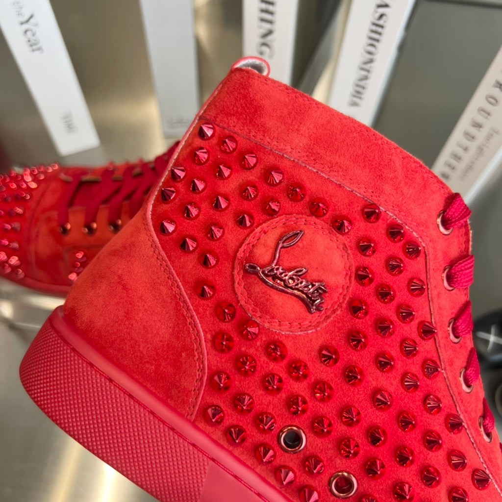 Zapatillas deportivas de lujo rojas con tachuelas de caña alta