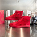 Zapatillas deportivas de lujo rojas con tachuelas de caña alta