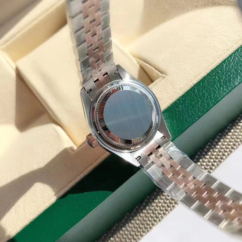 Reloj con esfera bicolor rosa
