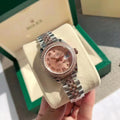 Reloj con esfera bicolor rosa