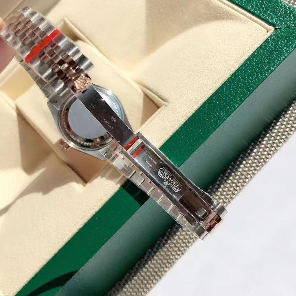 Reloj con esfera bicolor rosa