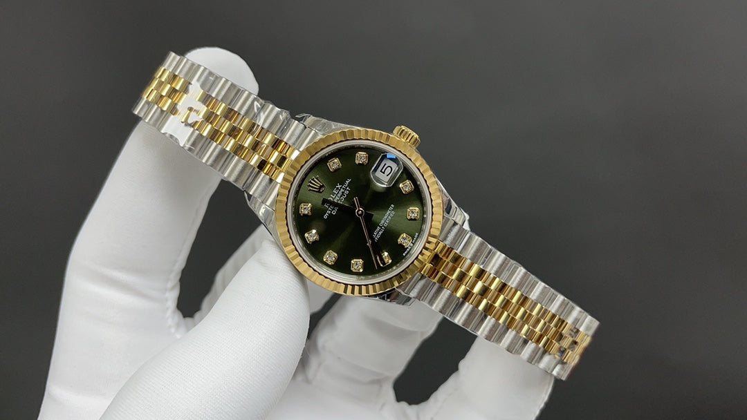 Reloj automático dorado y verde de 31 mm