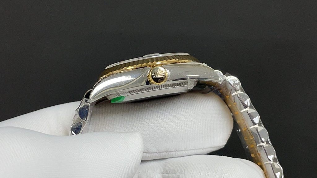 Reloj automático dorado y verde de 31 mm