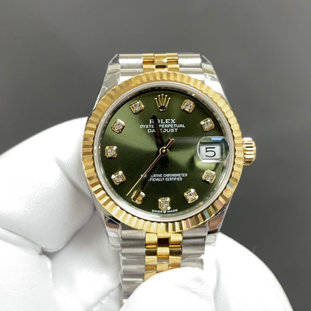 Reloj automático dorado y verde de 31 mm